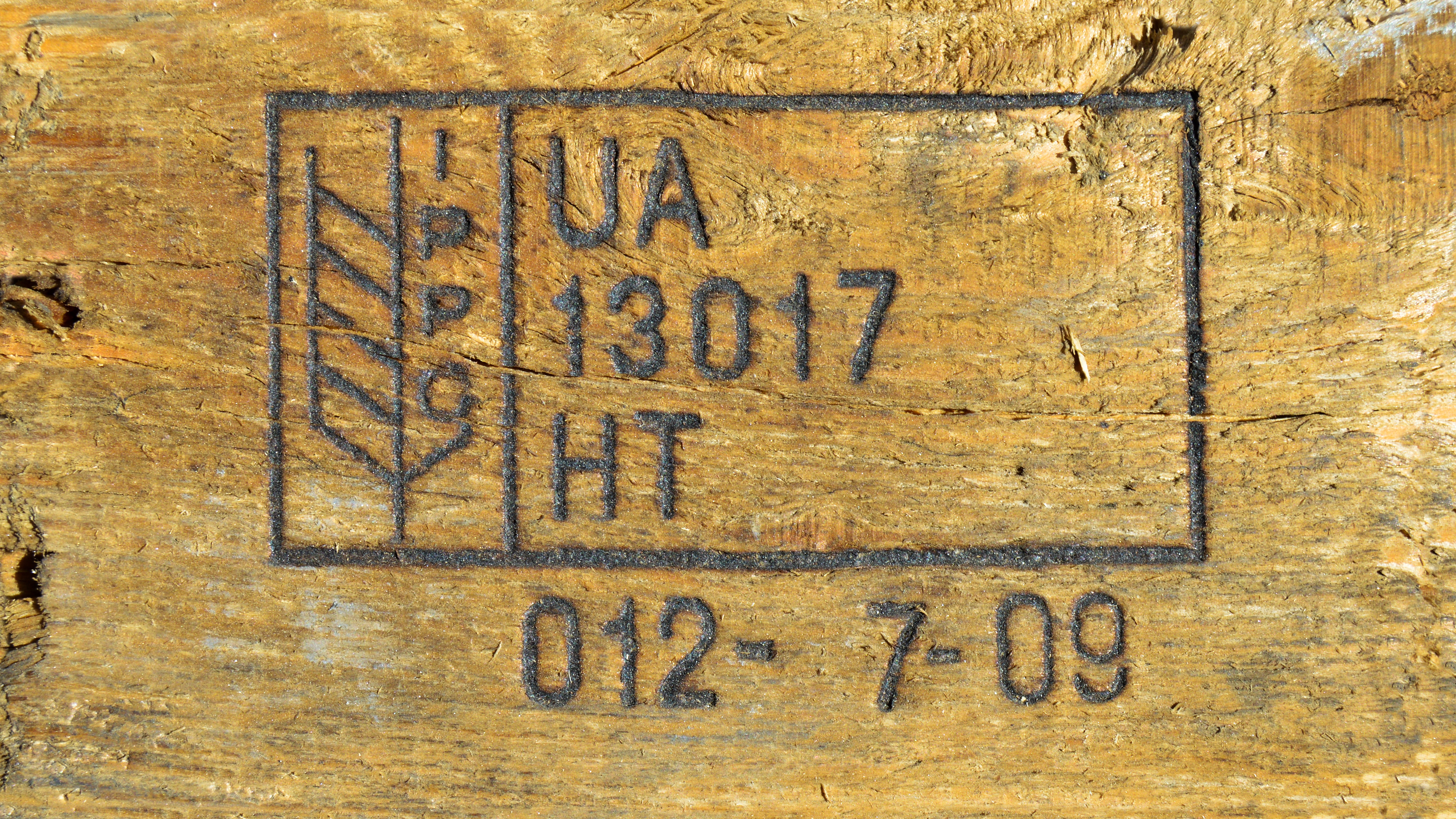 close up view of IPPC heat treatment mark on wood